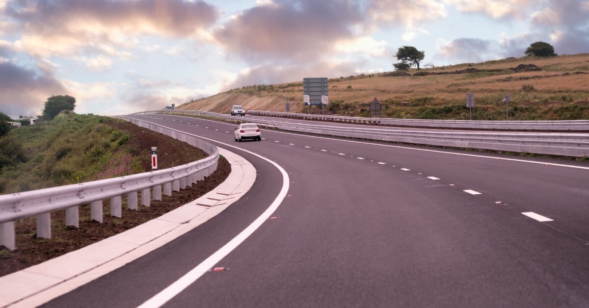 A UK dual carriageway with 3 cars driving