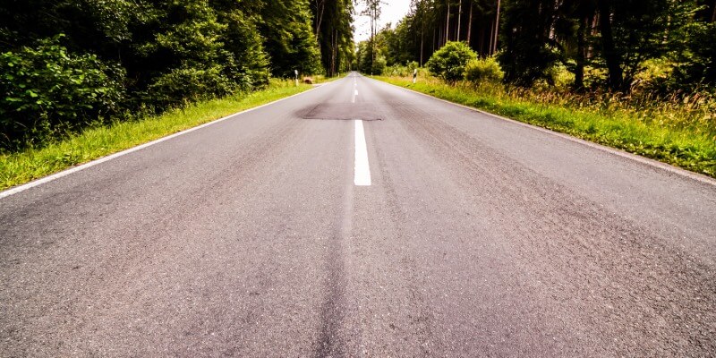 An empty single carriageway road